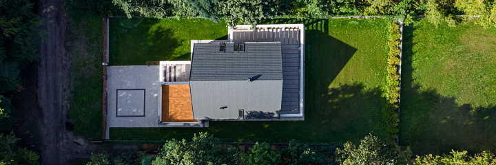 Panorama of elegant house exterior with nice green lawn garden, drone view