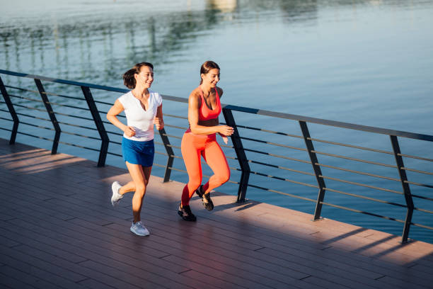 istock Two Caucasian women jogging 1257820782