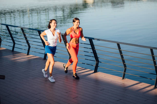 istock Two Caucasian women jogging 1257820787