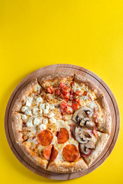 istock Pizza with vegetables on a bright yellow background. 1257823346