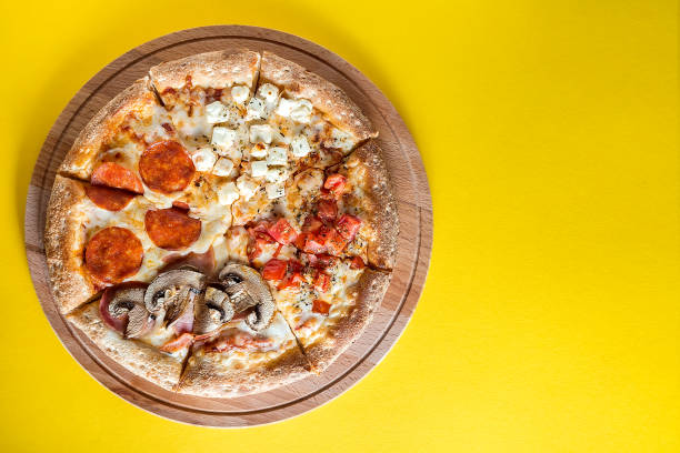 istock Pizza with vegetables on a bright yellow background. 1257823380