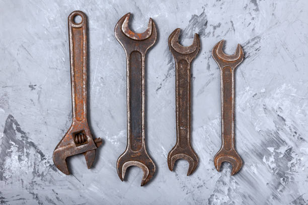 set of old locksmith tools on concrete background - work tool rusty old wrench imagens e fotografias de stock