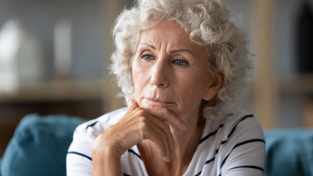istock Close up thoughtful mature woman worried about problems 1257831250