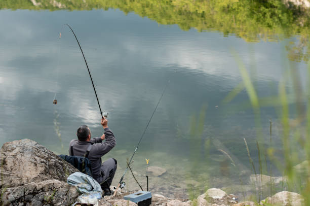 istock Fishermen by the water in summer 1257831376