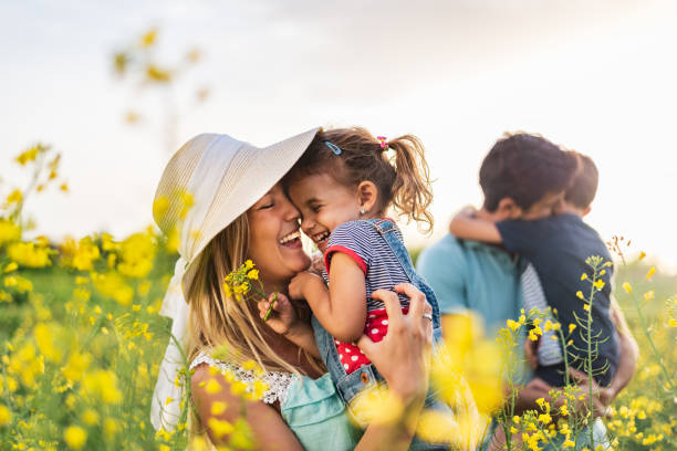 istock Young happy family enjoying nature 1257833181