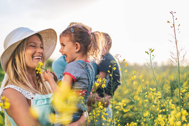 istock Young happy family enjoying nature 1257833422
