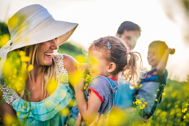 istock Young happy family enjoying nature 1257833453