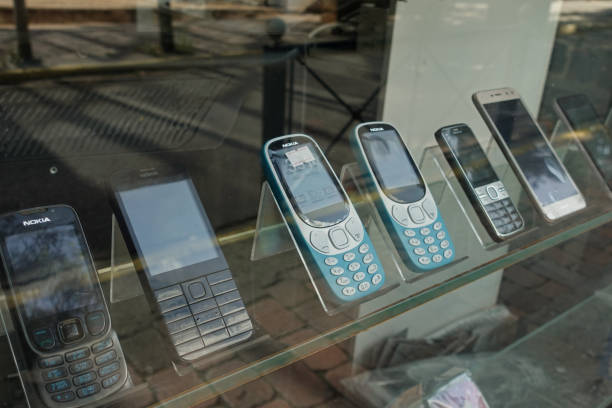 old mobile phones and used smartphones for sale Athens, Greece - June 7, 2020: Old mobile phones and smartphones for sale. Used cellphones shop window display. phone nokia stock pictures, royalty-free photos & images