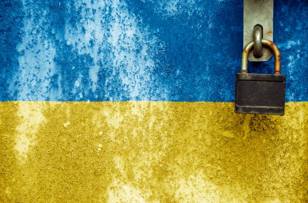istock Ukrainian flag is on texture. Template. Coronavirus pandemic. Countries are closed. Locks. 1257834418
