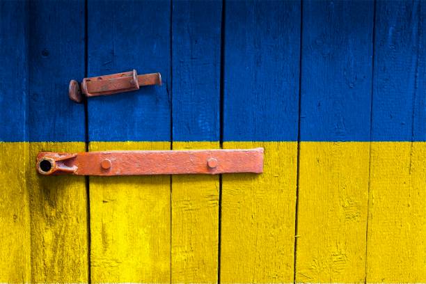 istock Ukrainian flag is on texture. Template. Coronavirus pandemic. Countries are closed. Locks. 1257834440