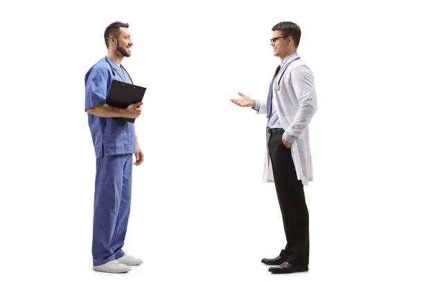 Photo of Two male healthcare workers having a conversation