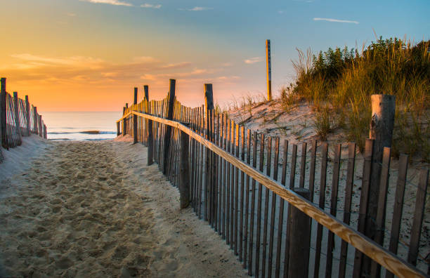 Morning arrives at the beach on Long Beach Island, NJ Sunrise glows at the Atlantic seashore at Marine St. in Beach Haven, New Jersey waters edge stock pictures, royalty-free photos & images