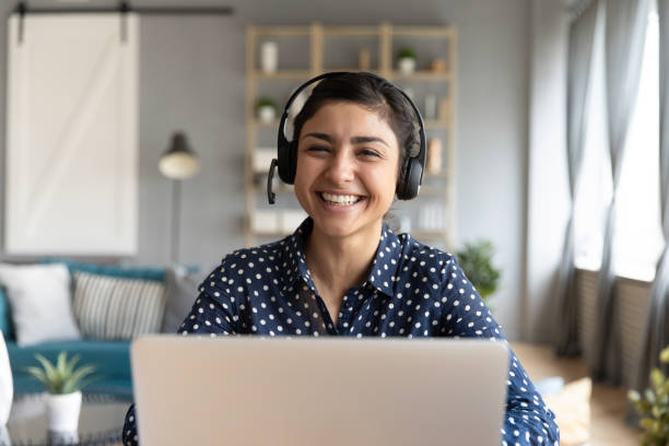 istock Happy indian woman professional tutor educating client online. 1257836741