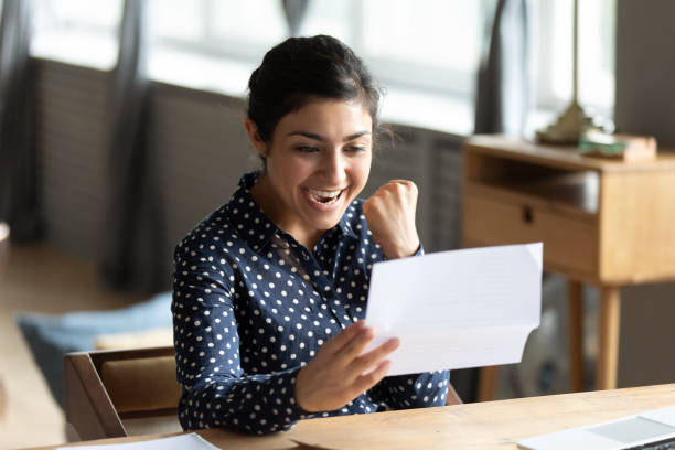 istock Happy hindu student received university admission letter. 1257836755