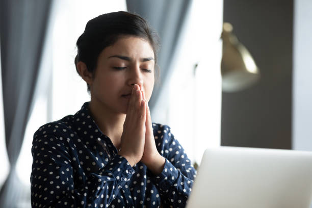 istock Focused millennial hindu woman asking for help good luck. 1257836769