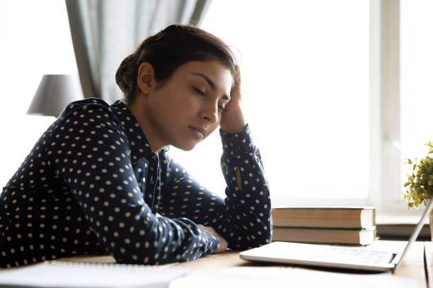 istock Tired overworked millennial hindu woman sleeping resting. 1257836777