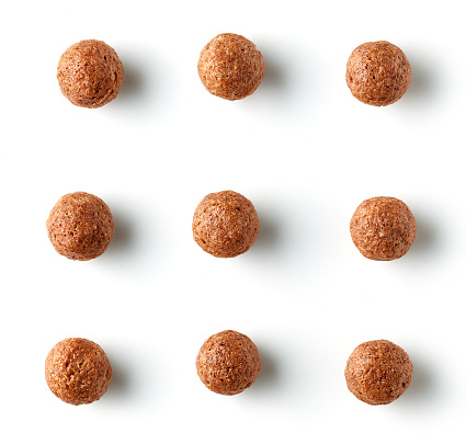 breakfast cereal chocolate balls isolated on white background, top view