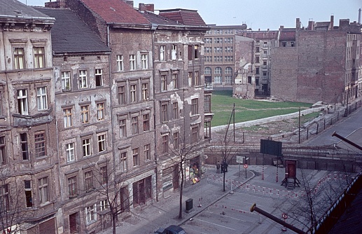Old Berlin street, with even war-drawn tenements  and the Berlin Wall, just two years old