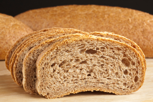 hand holding freshly baked ciabatta