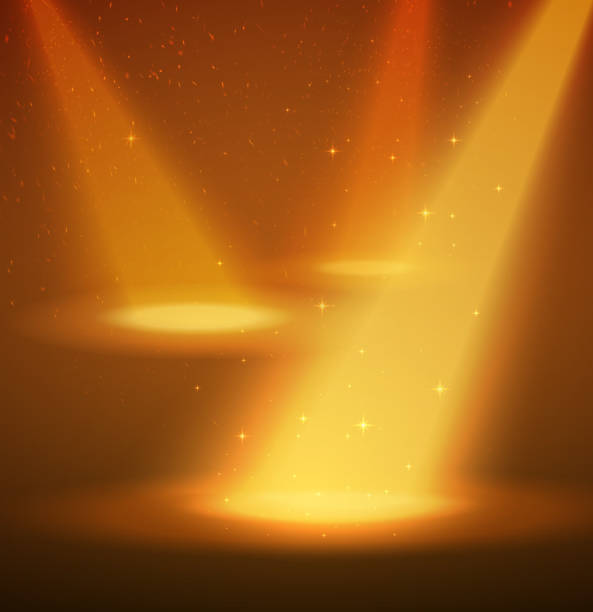 istock Yellow spotlight on the scene. Smoke, dust and stars for nice background. 1257839215