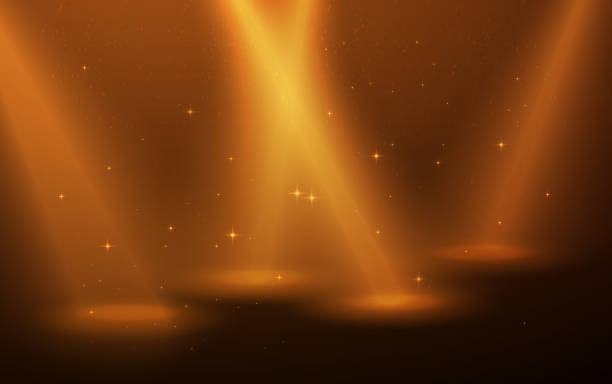 istock Yellow spotlight on the scene. Smoke, dust and stars for nice background. 1257839226