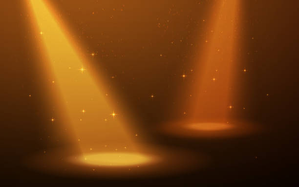 istock Yellow spotlight on the scene. Smoke, dust and stars for nice background. 1257839236