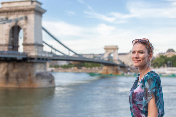 istock Woman posing at Chain Bridge, Budapest, Hungary 1257839452