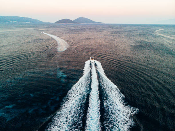 aerial view of a speedboat travelling over the sea - nautical vessel speedboat motorboat yacht imagens e fotografias de stock