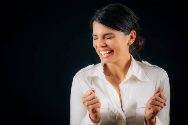 istock Beautiful Young Excited Woman Smiling, Expressing Excitement 1257841730