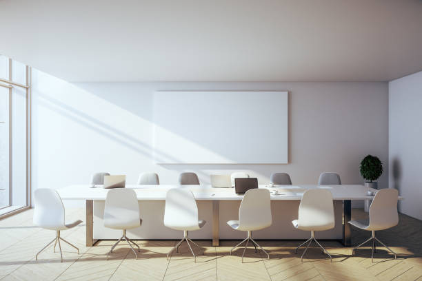 istock Contemporary conference interior with laptop and blank poster 1257842544