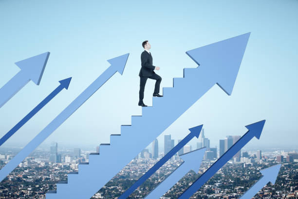 istock Businessman climbs stairs in form blue arrow 1257842577