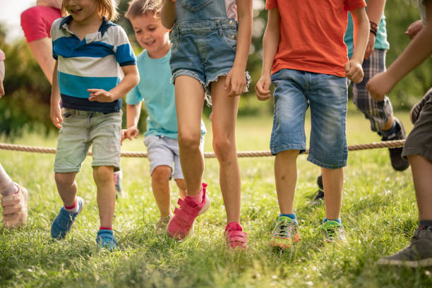istock Children jumping over a rope 1257842935