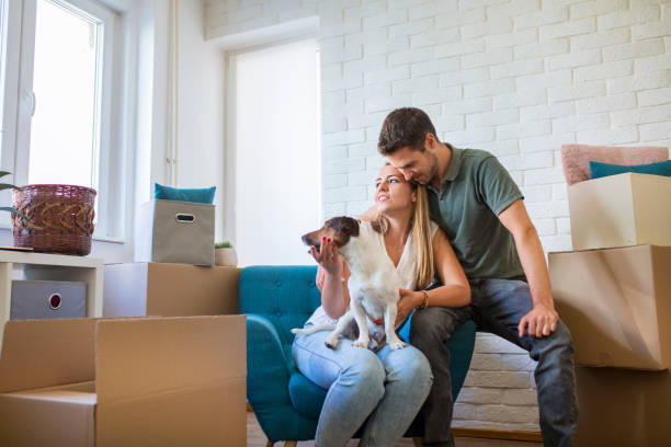 istock Young couple moving in into new apartment 1257843640