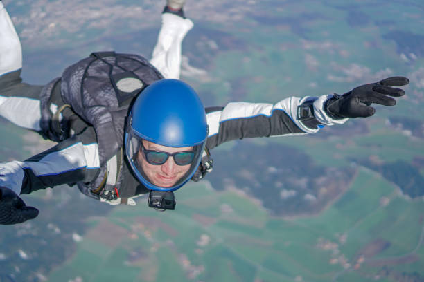 istock Freefall jumper soars above mountain landscape 1257843683