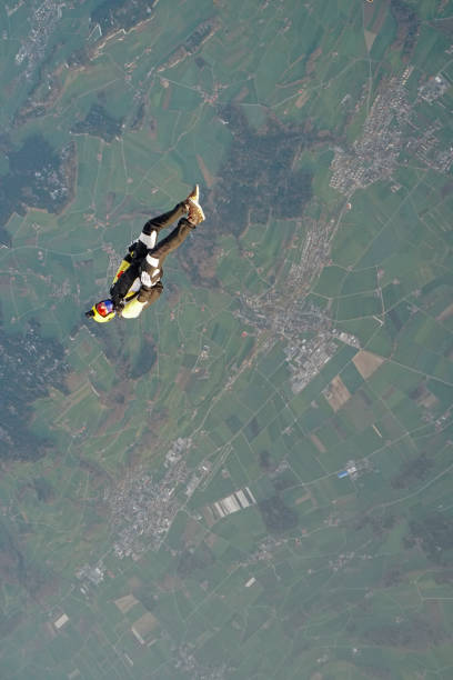 istock Freefall jumper soars above mountain landscape 1257843801