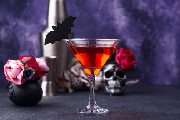 istock Halloween martini cocktail on purple background 1257844401