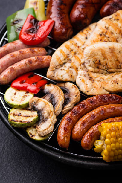 istock Grilled sausages, meat, and vegetables. 1257844443
