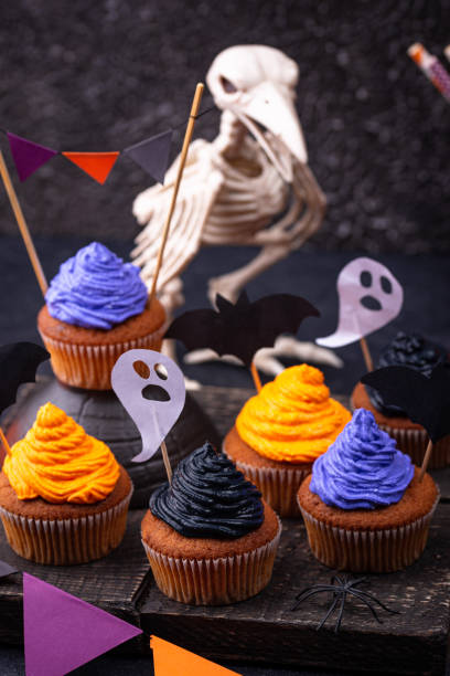 istock Halloween cupcakes with color cream 1257845083