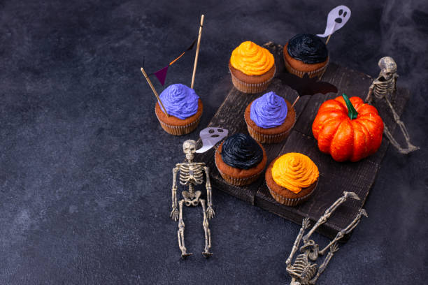 istock Halloween cupcakes with color cream 1257845091