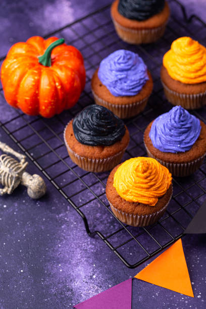 istock Halloween cupcakes with color cream 1257845113