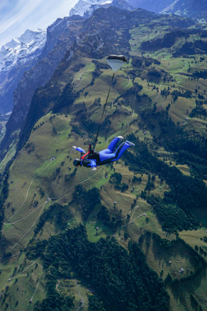 istock Freefall jumper soars above mountain landscape 1257845523
