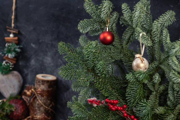 istock Christmas background - baubles and branch of spruce tree 1257847613