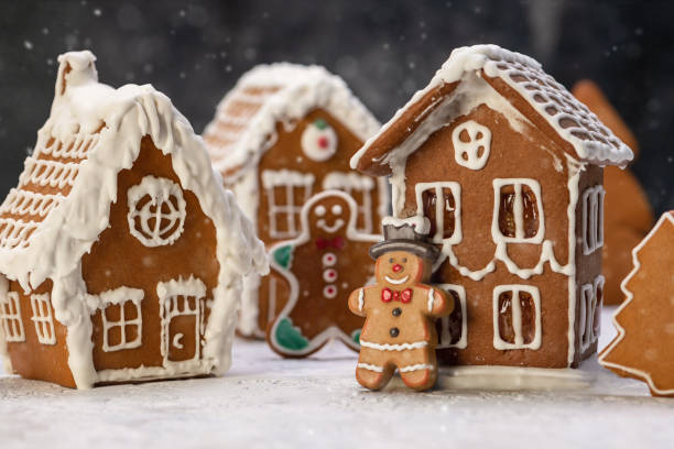 istock Homemade Christmas Gingerbread houses on a white table 1257848182