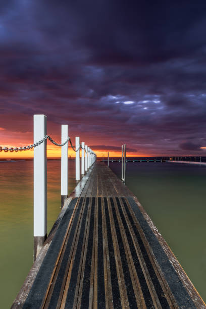 istock Sunrise over a rock pool in Narrabeen Australia 1257848257