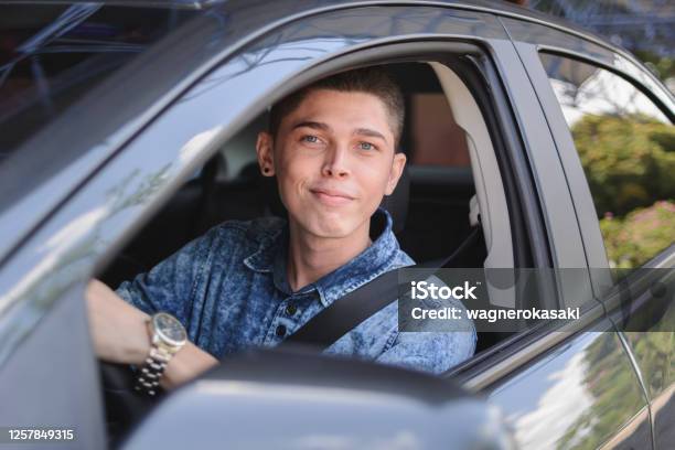 Portrait Of Young Man Driving A Car Stock Photo - Download Image Now - Driver's License, 20-29 Years, Achievement