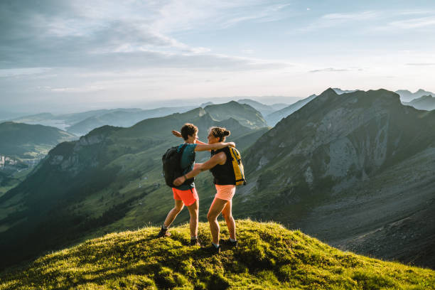 istock Trail runners ascend high mountain ridge 1257851002