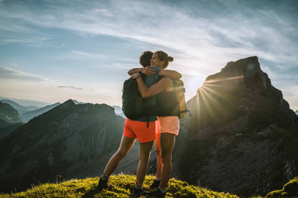 istock Trail runners ascend high mountain ridge 1257851104