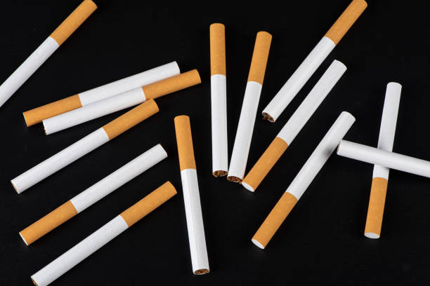 istock The pile of cigarettes on black background 1257853477