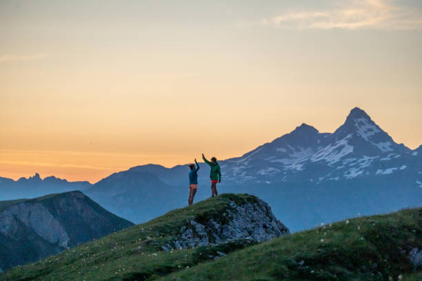 istock Trail runners ascend high mountain ridge 1257853544