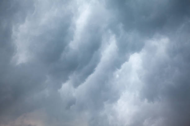 Grey Clouds in the winter Grey Clouds During of Winter Day storm cloud sky dramatic sky cloud stock pictures, royalty-free photos & images